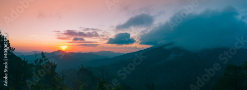 Panoramic mountain landscape. Majestic sunrise of the mountains layer in the morning. Serenity in nature.