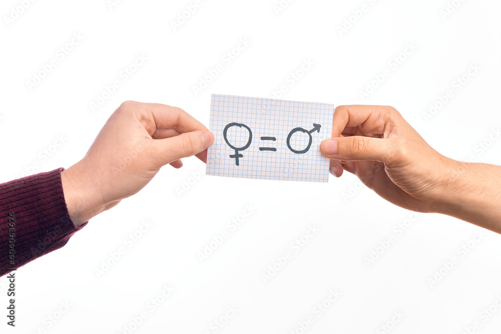 Cardboard banner with female and male symbol, women and men are equal message over isolated white background Cardboard banner with female and male symbol, women and men are equal message over isolated white background