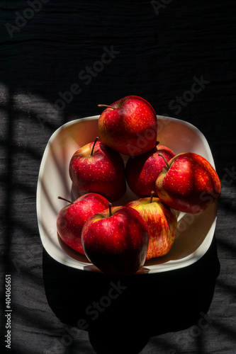 A bunch of healthy apples stacked together in a bowl