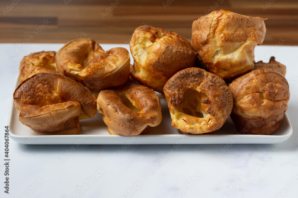 Fototapeta premium Yorkshire Puddings side view on a white tray