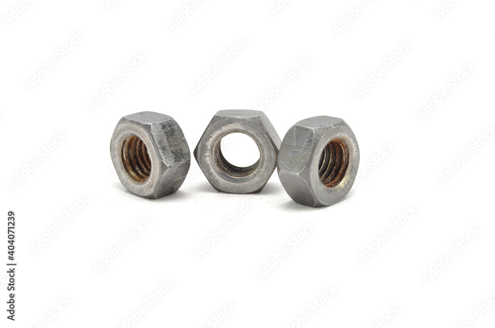 Rusty nuts on white background close-up. engineering, industry, technology Rusty nuts on white background close-up. engineering, industry, technology
