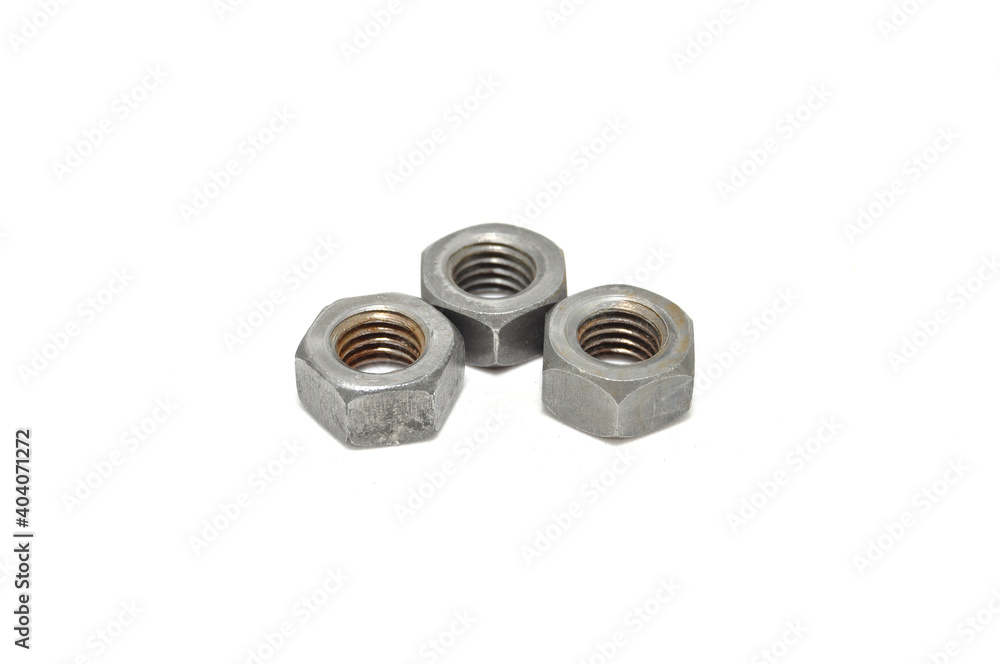 Rusty nuts on white background close-up. engineering, industry, technology Rusty nuts on white background close-up. engineering, industry, technology