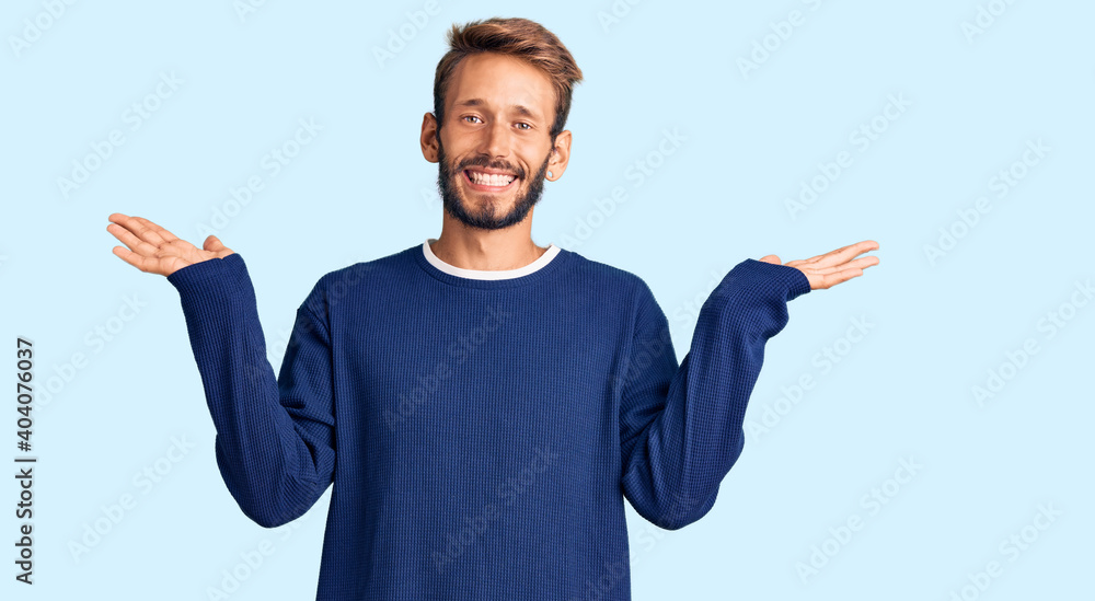 Handsome blond man with beard wearing casual sweater celebrating crazy and amazed for success with arms raised and open eyes screaming excited. winner concept Handsome blond man with beard wearing casual sweater celebrating crazy and amazed for success with arms raised and open eyes screaming excited. winner concept
