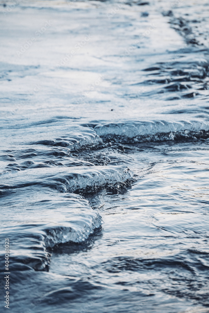 freezing ice covered lake, waves