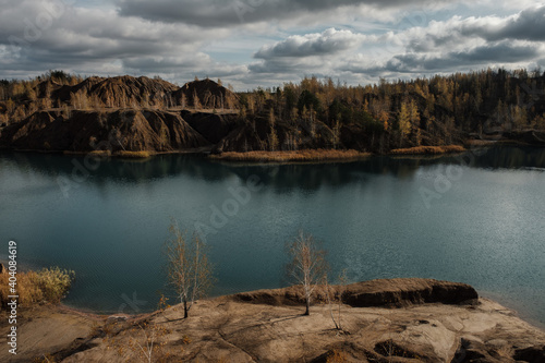 Fototapeta Naklejka Na Ścianę i Meble -  Turquoise quarry at Romantsevo, Konduki,. Tula region, Russia. Extraction of coal. Autumn landscape