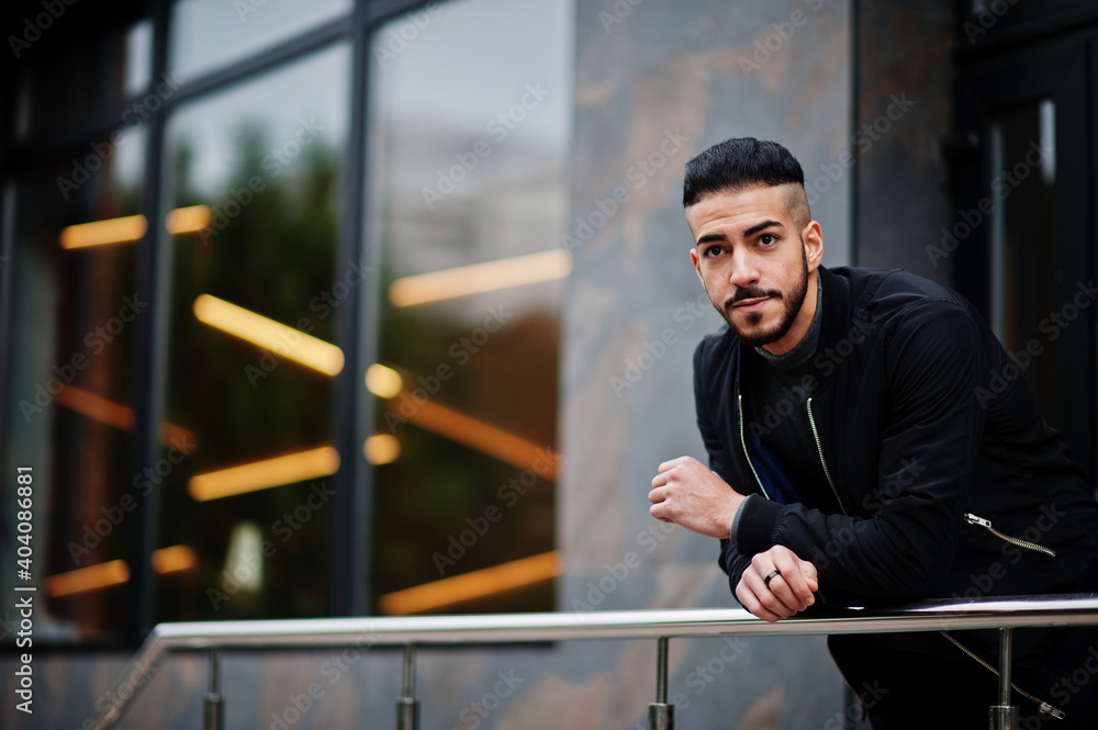 Portrait of stylish arab beard man wear grey turtleneck and black jaket. Arabian model guy. Portrait of stylish arab beard man wear grey turtleneck and black jaket. Arabian model guy.