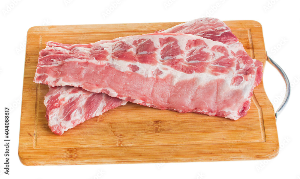 Two pork ribs on a board on a white background, isolate
