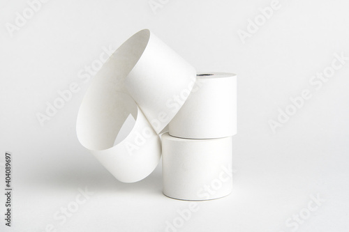 Cash register paper rolled on white background