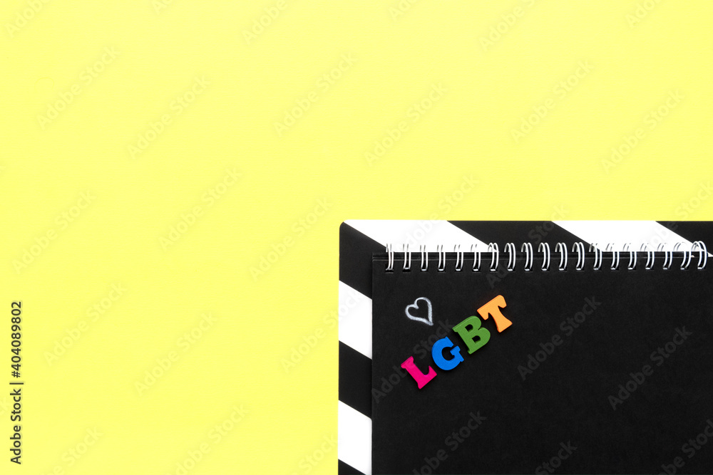 Fototapeta premium lgbt word from multicolored letters. copy space