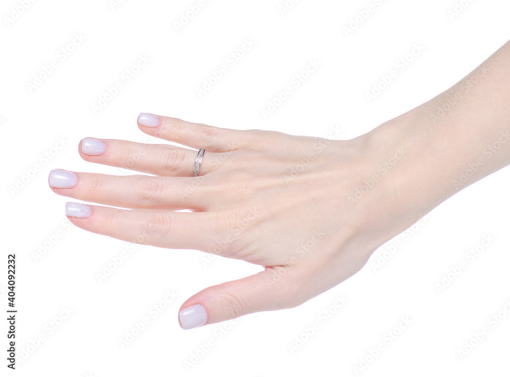 Female hand with gold ring of finger on white background isolation