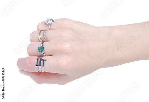 Female hand with many rings on white background isolation