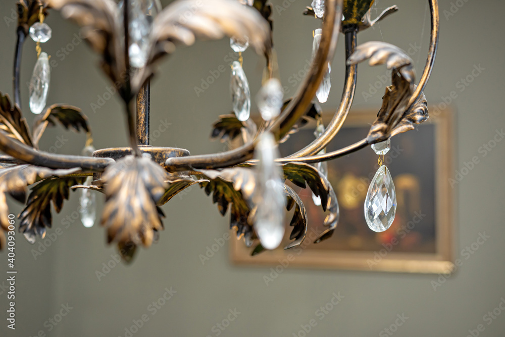 close up detail of crystal pendant chandelier, selective focus, blurred background close up detail of crystal pendant chandelier, selective focus, blurred background