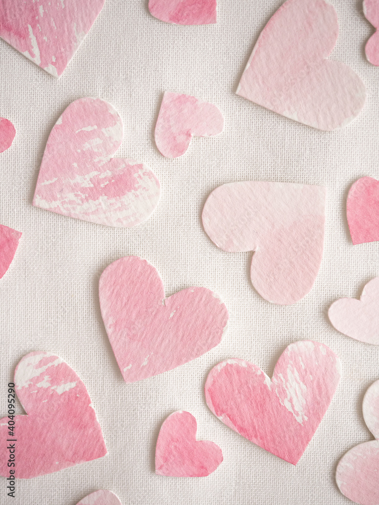 Obraz premium Paper hearts painted in pink watercolor on a white background