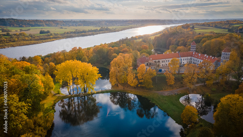 Fototapeta Naklejka Na Ścianę i Meble -  Aerial view of old castle during sunset in summer in Lithuania near river Neman by drone