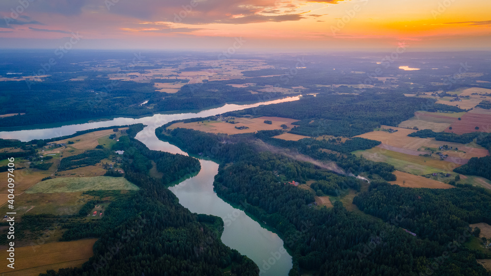 Aerial view of lake Vilkoksnis during sunset by drone