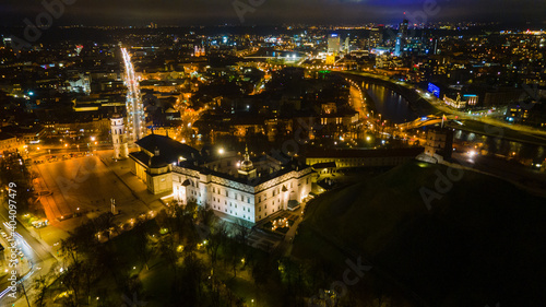 Aerial view of Vilnius old town at night by drone