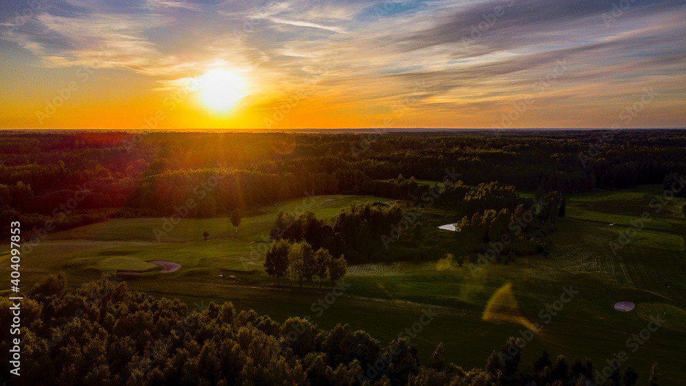 Aerial view of European centre golf club during sunset by drone
