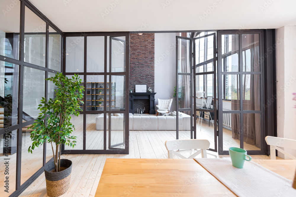 trendy modern design two-level apartment with large high windows. The ...