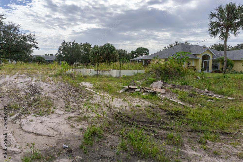 Abandoned construction site overgrown with weeds Abandoned construction site overgrown with weeds