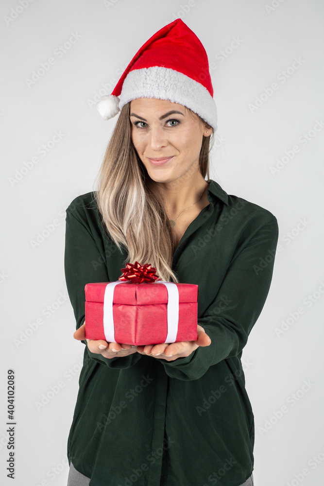 beautiful young woman wearing a santa hat with red Christmas gift beautiful young woman wearing a santa hat with red Christmas gift