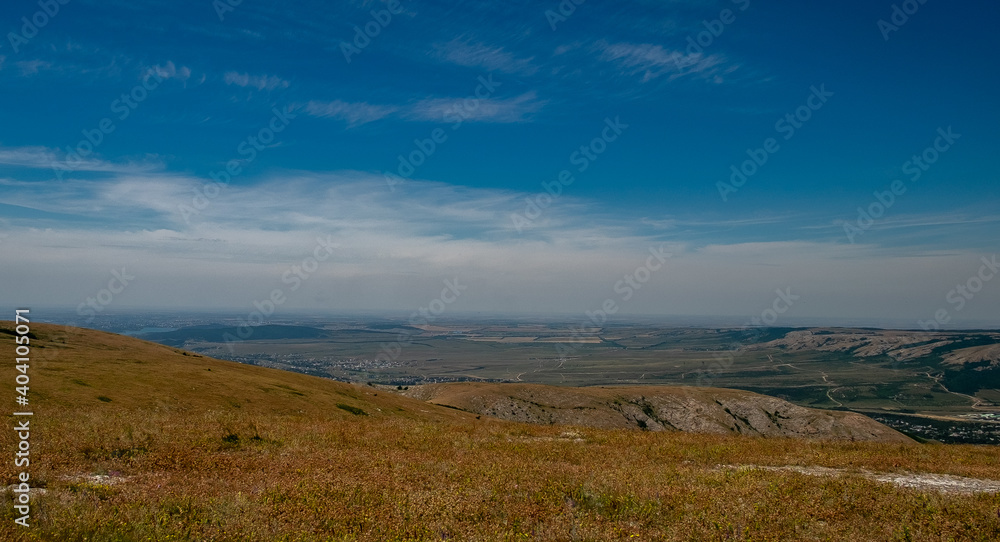 Pid to the surrounding mountains from the lower plateau of Chatyr-Dag in Crimea on a clear sunny day. Pid to the surrounding mountains from the lower plateau of Chatyr-Dag in Crimea on a clear sunny day.