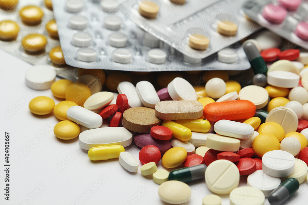 Different colorful tablets at white background Different colorful tablets at white background