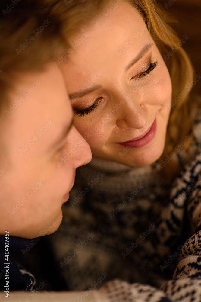 Image of young happy man kissing and hugging beautiful woman Image of young happy man kissing and hugging beautiful woman
