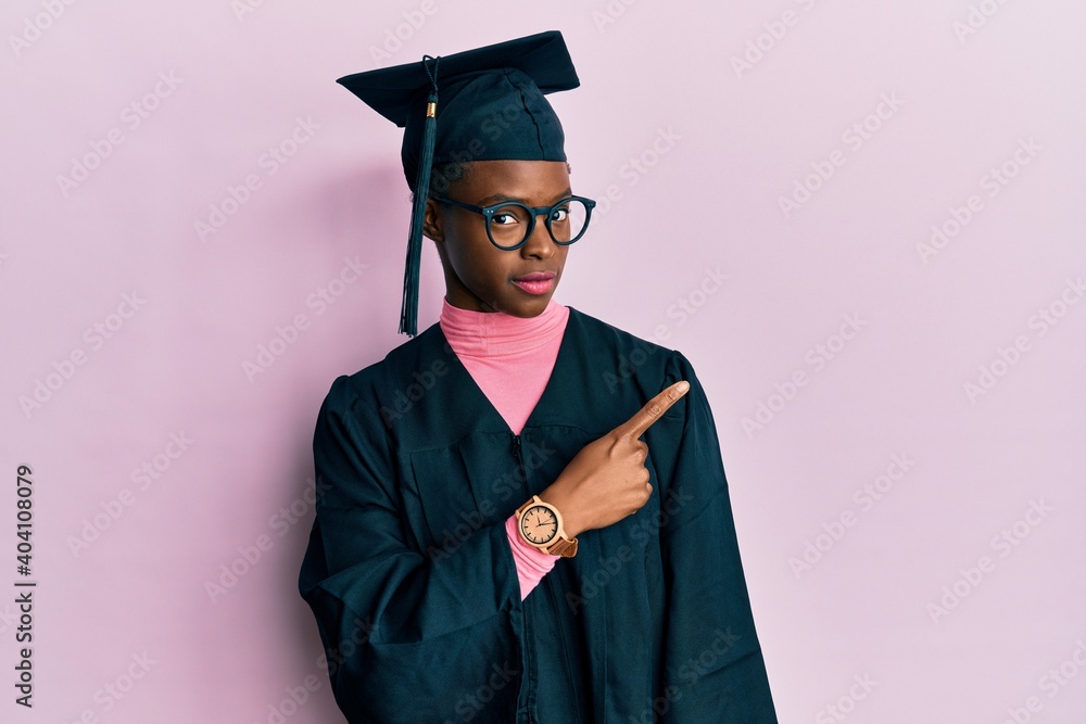 Young african american girl wearing graduation cap and ceremony
