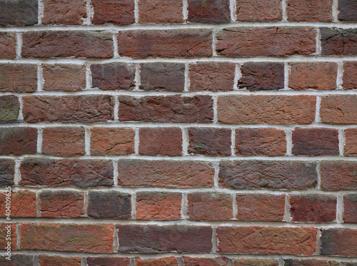 Background of terracotta brickwork in various shades of brown orange