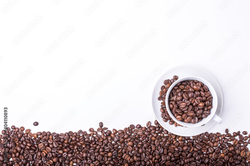 Naklejka premium top view of White cup filled with freshly roasted coffee beans
