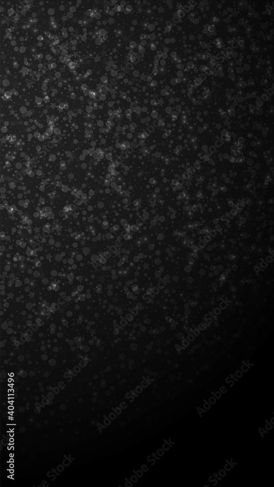 Obraz premium Magic stars Christmas background. Subtle flying snow flakes and stars on black background. Amusing winter silver snowflake overlay template. Pleasing vertical illustration.