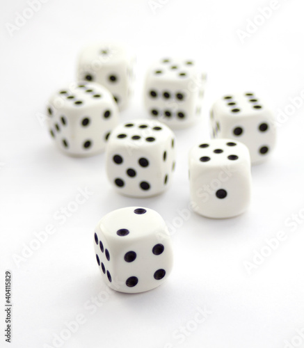 Set of white plastic dices isolated on white
