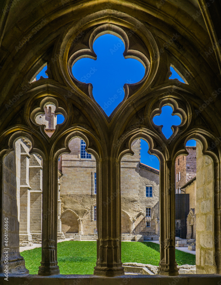 Naklejka premium the ogival arch of the gothic cloister in the La Chaise Dieu abbey in Auvergne, France