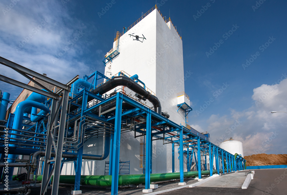Air-separating factory for producing industrial gases, blue pipes and drone monitoring of equipment Air-separating factory for producing industrial gases, blue pipes and drone monitoring of equipment