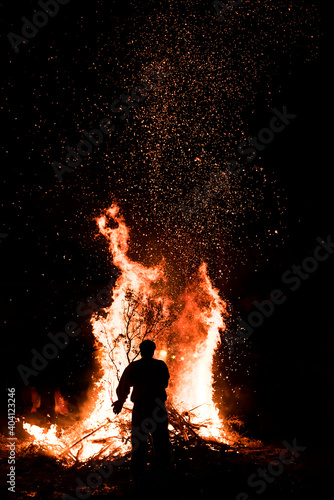 putting fire to celebrate St John's Eve. A traditional greek custom