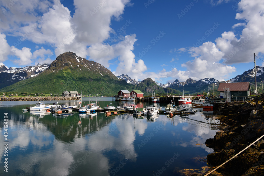 summerly harbor of the village hennes, the entrance to the møysalen national park in norway