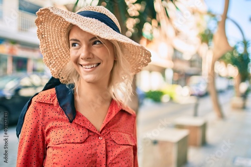 Young blonde tourist woman smiling happy walking at the city. © Krakenimages.com