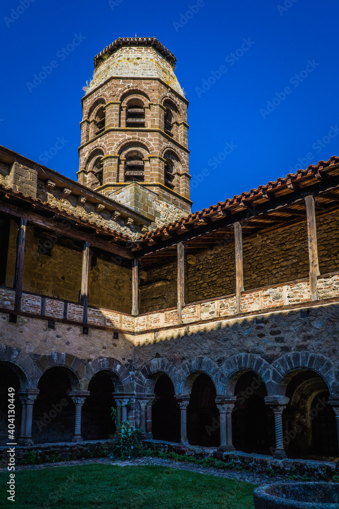 The romanesque cloister and bell tower of the St Andre abbey in Lavaudieu (Auvergne, France)