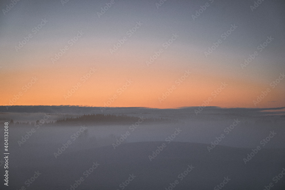 sunrise over the fields of toten, norway, in winter