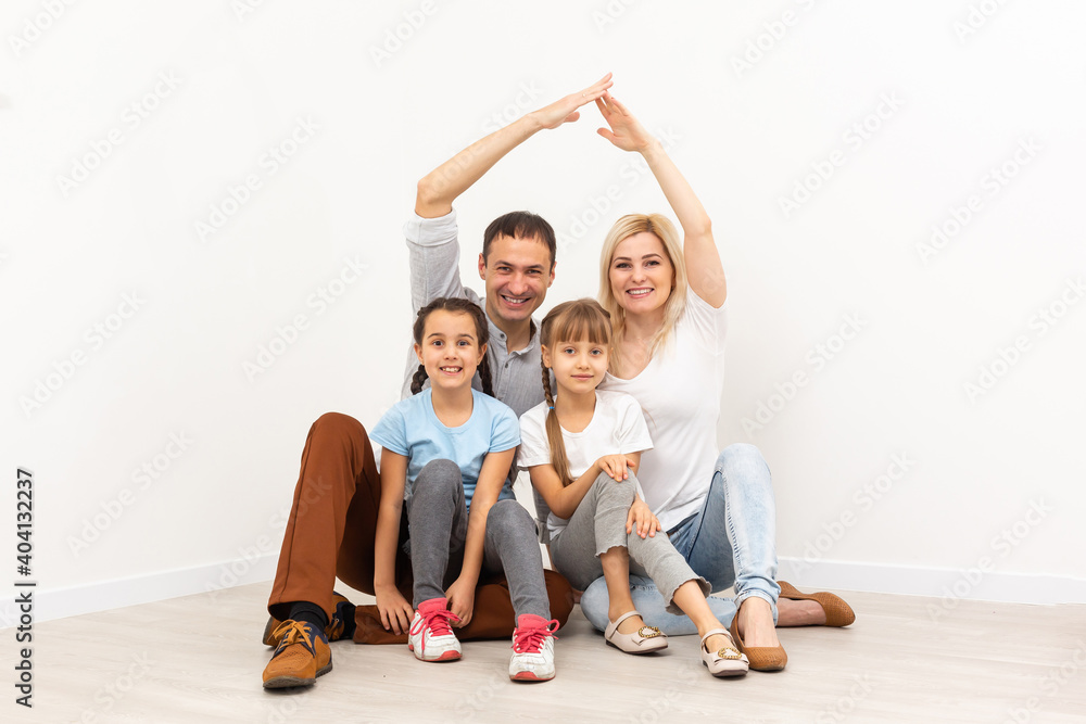 concept housing a young family. mother father and children in a new home concept housing a young family. mother father and children in a new home