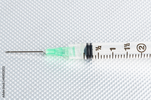 Hygienic Single-Use Disposable Injection On Metal Background photo