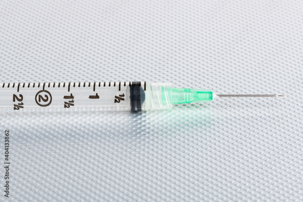 Hygienic Single-Use Disposable Injection On Metal Background Hygienic Single-Use Disposable Injection On Metal Background