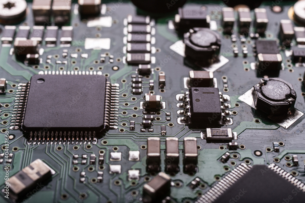 Fototapeta premium Computer circuits hardware close up. Motherboard parts, chips, connections, circuit boards visible.