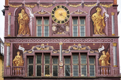 Architectural detail of old Hotel de Ville (Town Hall) on Place de la Reunion. The paintings depict the vices and virtues. The building dates from 1552. Mulhouse, Alsace, France. photo