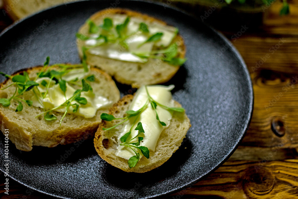 sandwiches with micro greens sprouts on a plate, close-up, wellness food sandwiches with micro greens sprouts on a plate, close-up, wellness food