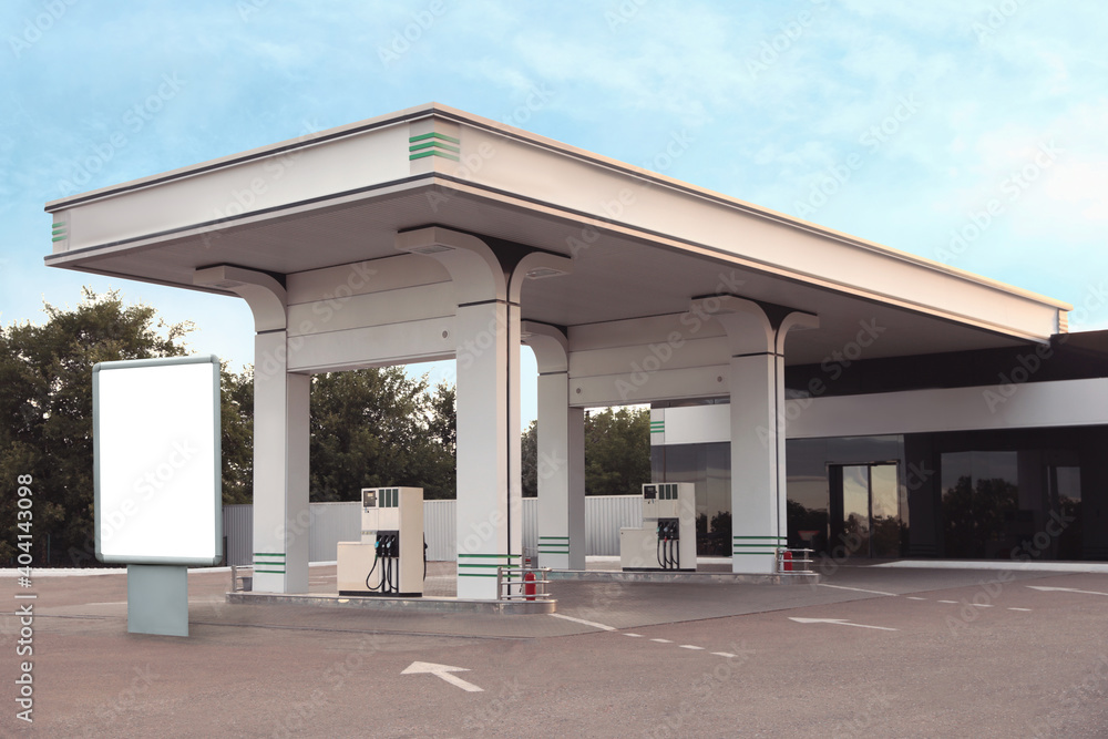 Fototapeta premium Empty billboard on modern gas station outdoors, space for design