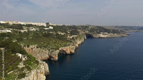 Castro, Italy. Aerial view of an aperture on the Ionian coast below the city. Panoramic vista of the magnificent stalactite-festooned Cave of Zinzulusa. High quality 4k footage photo