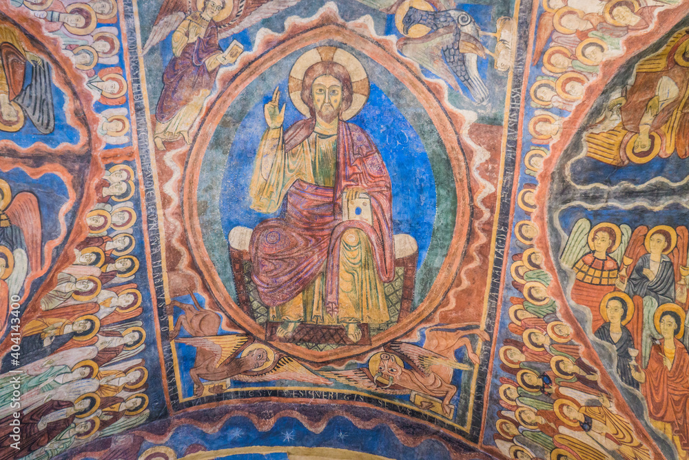 Details of religious frescos inside the romanesque St Julien Basilica in Brioude, Auvergne (France)