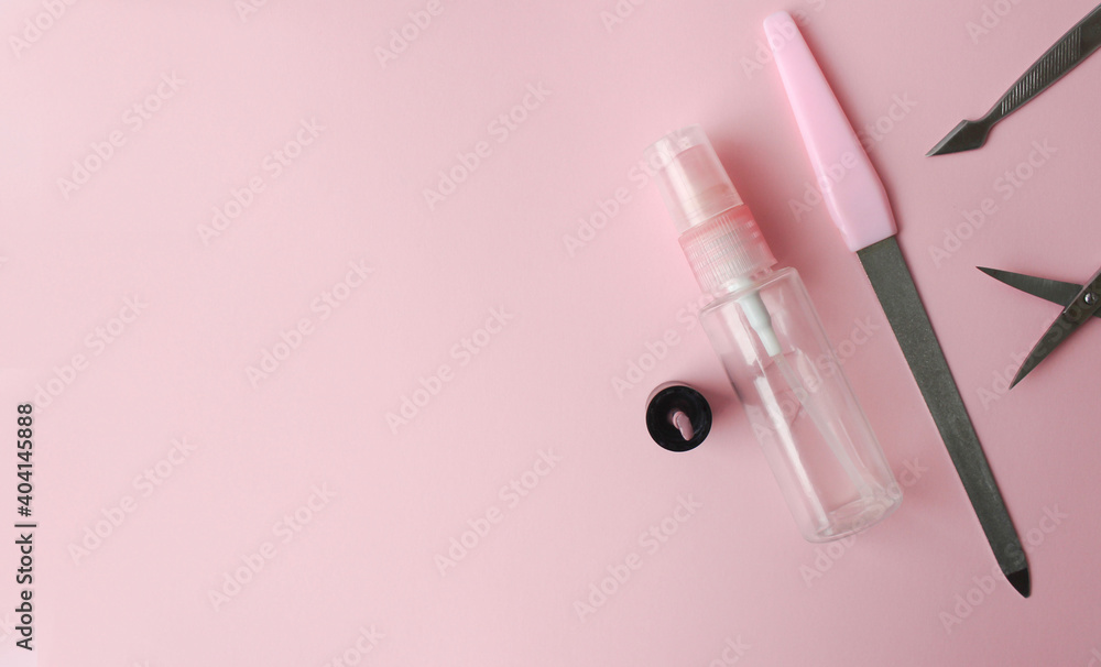 Set for manicure on a pink background. Nail polish, scissors on a pink background. Set for manicure on a pink background. Nail polish, scissors on a pink background.