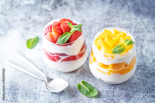 Greek yogurt strawberry and mango parfait in glasses